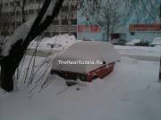 Old Soviet car in snowdrift
